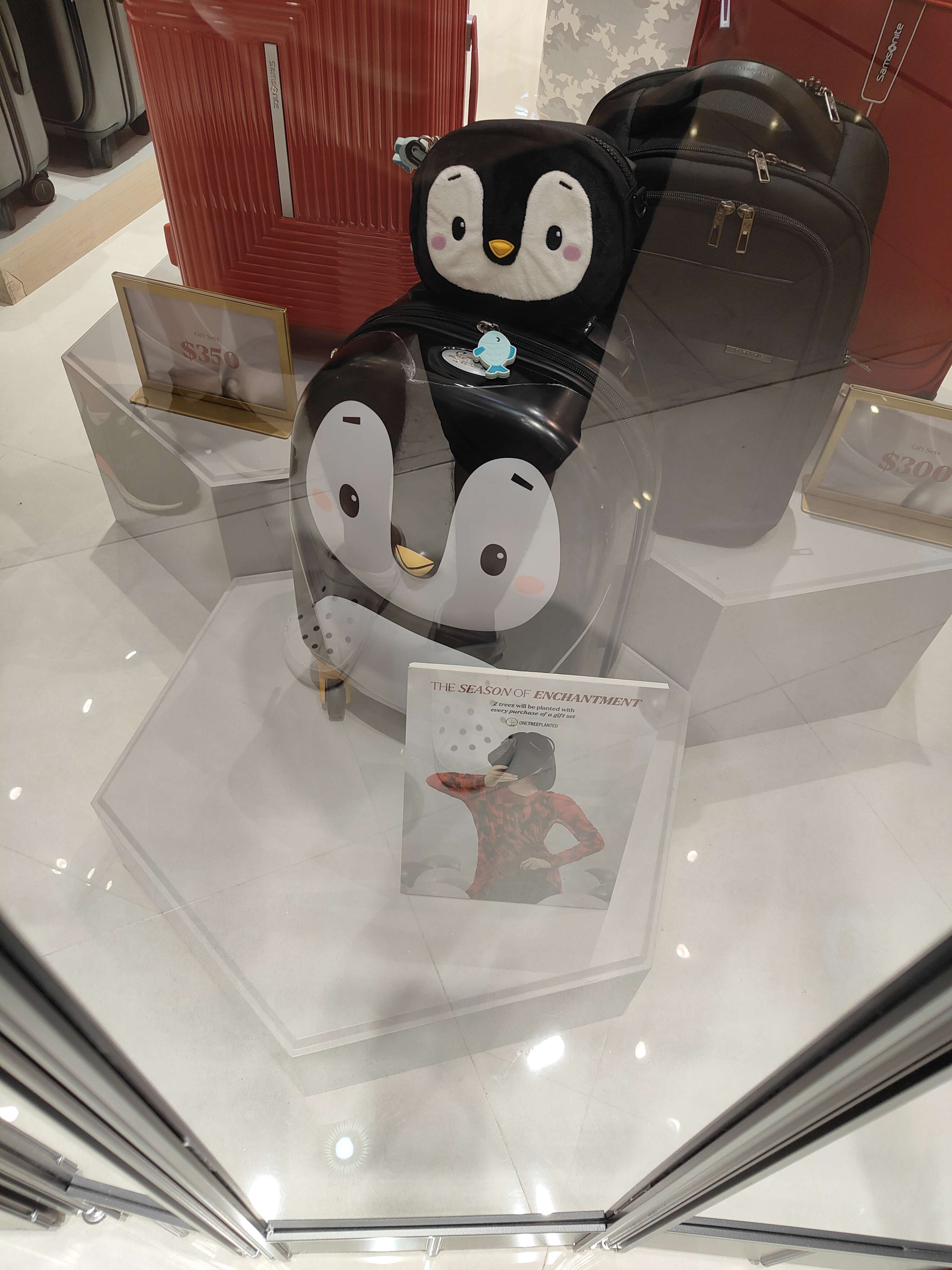 A luggage shop in Vivo City selling penguin luggages.